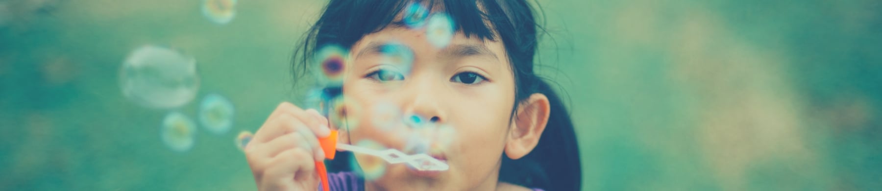 Girl blowing bubbles